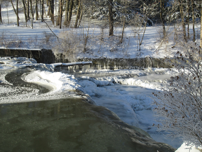 Fall Creek with ice on dam after a quick thaw was followed by a rapid freeze. January 2018